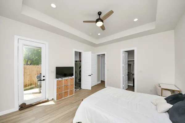 a living room with furniture and a ceiling fan