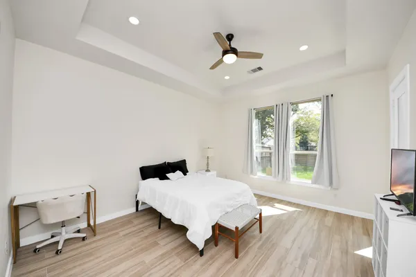 a bedroom with a bed and a window