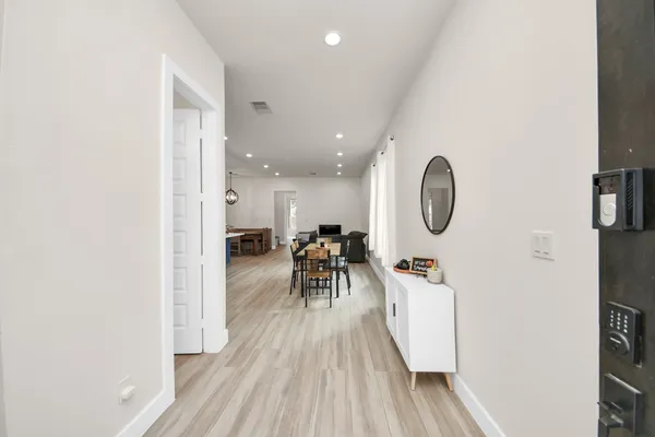 a view of kitchen island with furniture and wooden floor