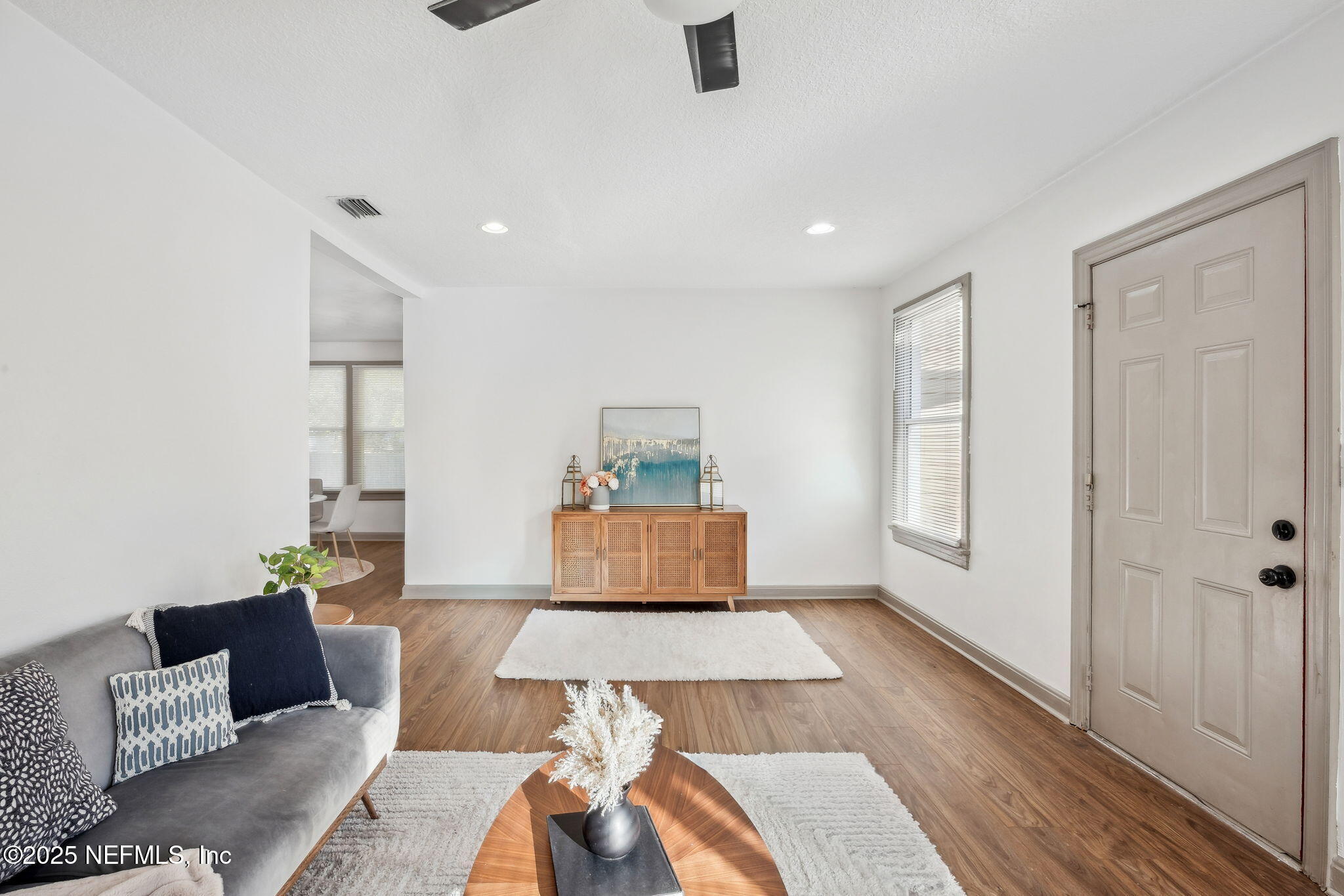 4615 Woolman Avenue Jacksonville, FL 32205 - Photo 11 of 34 a living room with furniture and a wooden floor