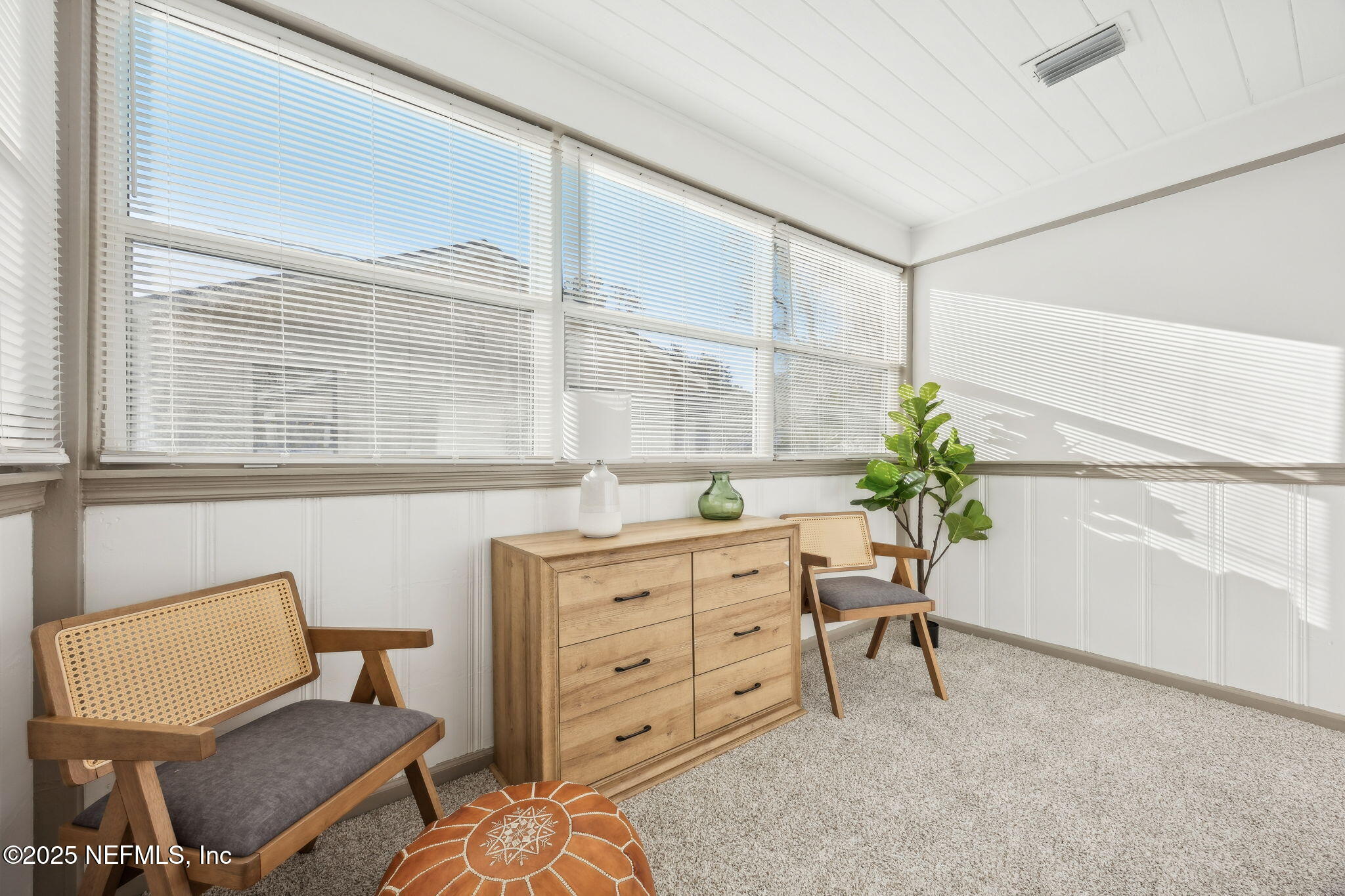 4615 Woolman Avenue Jacksonville, FL 32205 - Photo 12 of 34 a dining room with furniture and a window