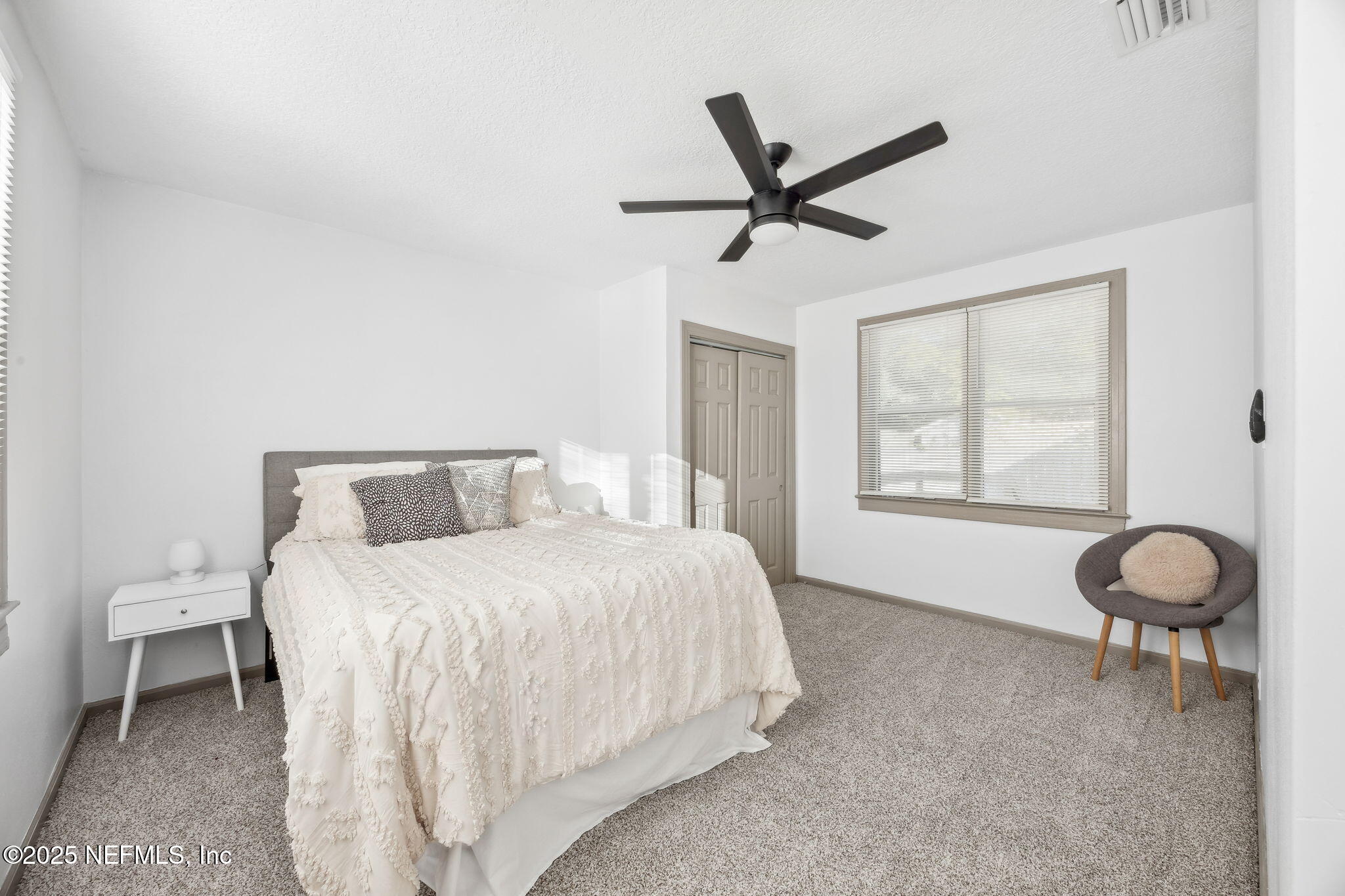 4615 Woolman Avenue Jacksonville, FL 32205 - Photo 20 of 34 a bedroom with a bed and a window