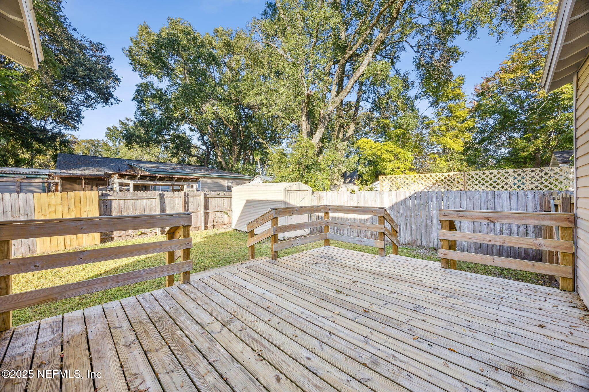 4615 Woolman Avenue Jacksonville, FL 32205 - Photo 31 of 34 a view of a deck with chairs and wooden floor