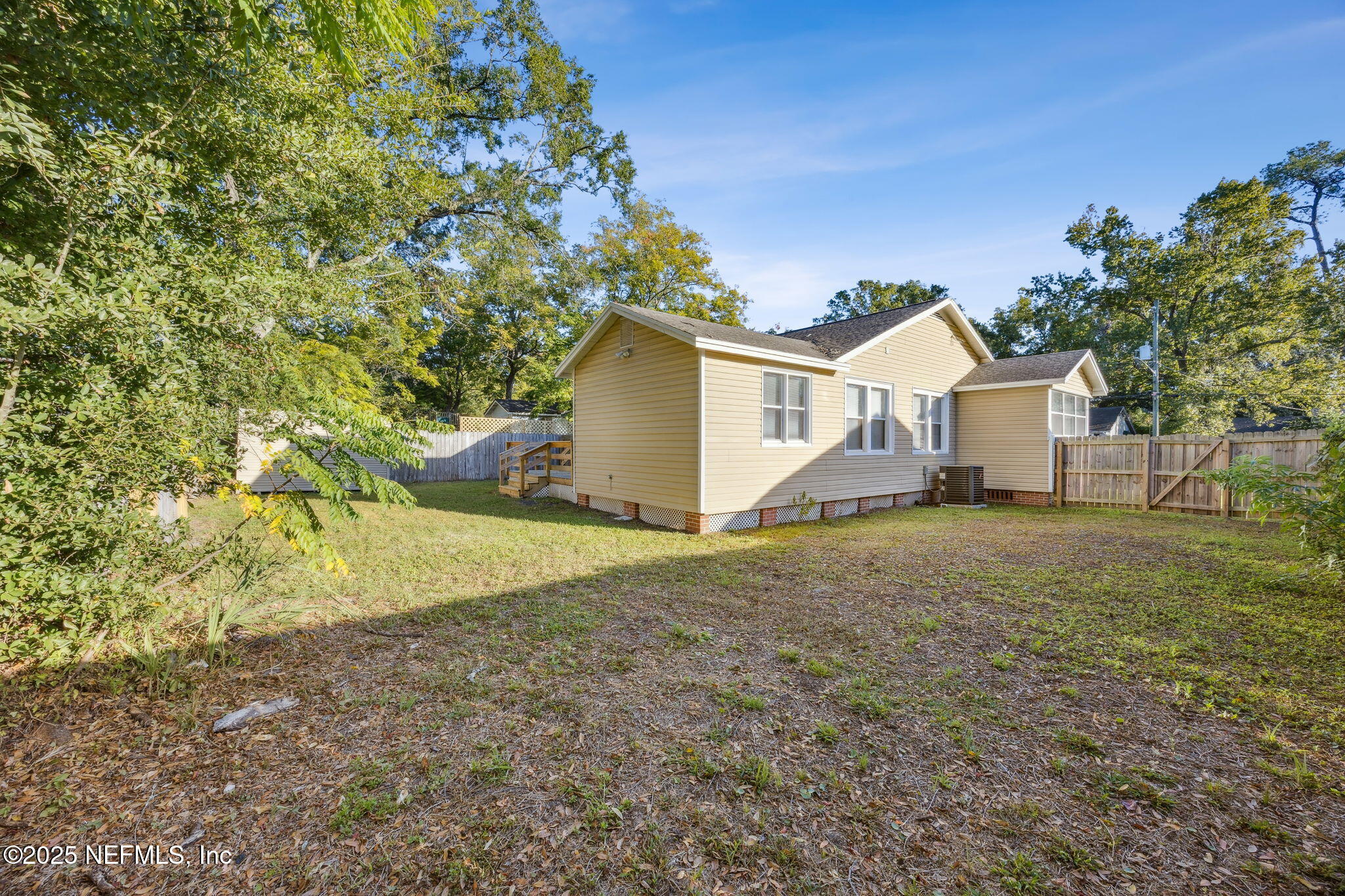 4615 Woolman Avenue Jacksonville, FL 32205 - Photo 33 of 34 a view of a house with a yard and garage
