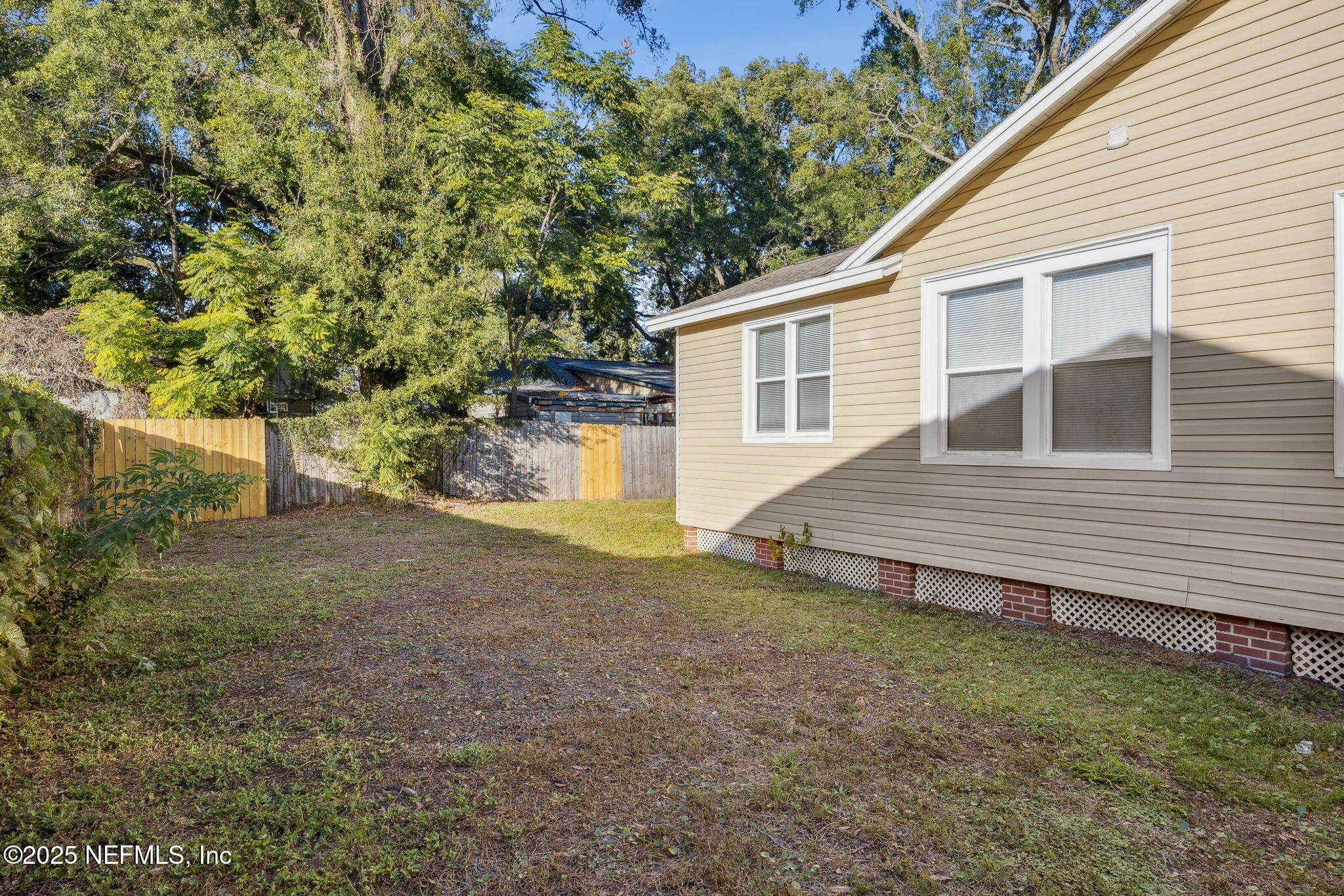 4615 Woolman Avenue Jacksonville, FL 32205 - Photo 34 of 34 a view of a house with a yard