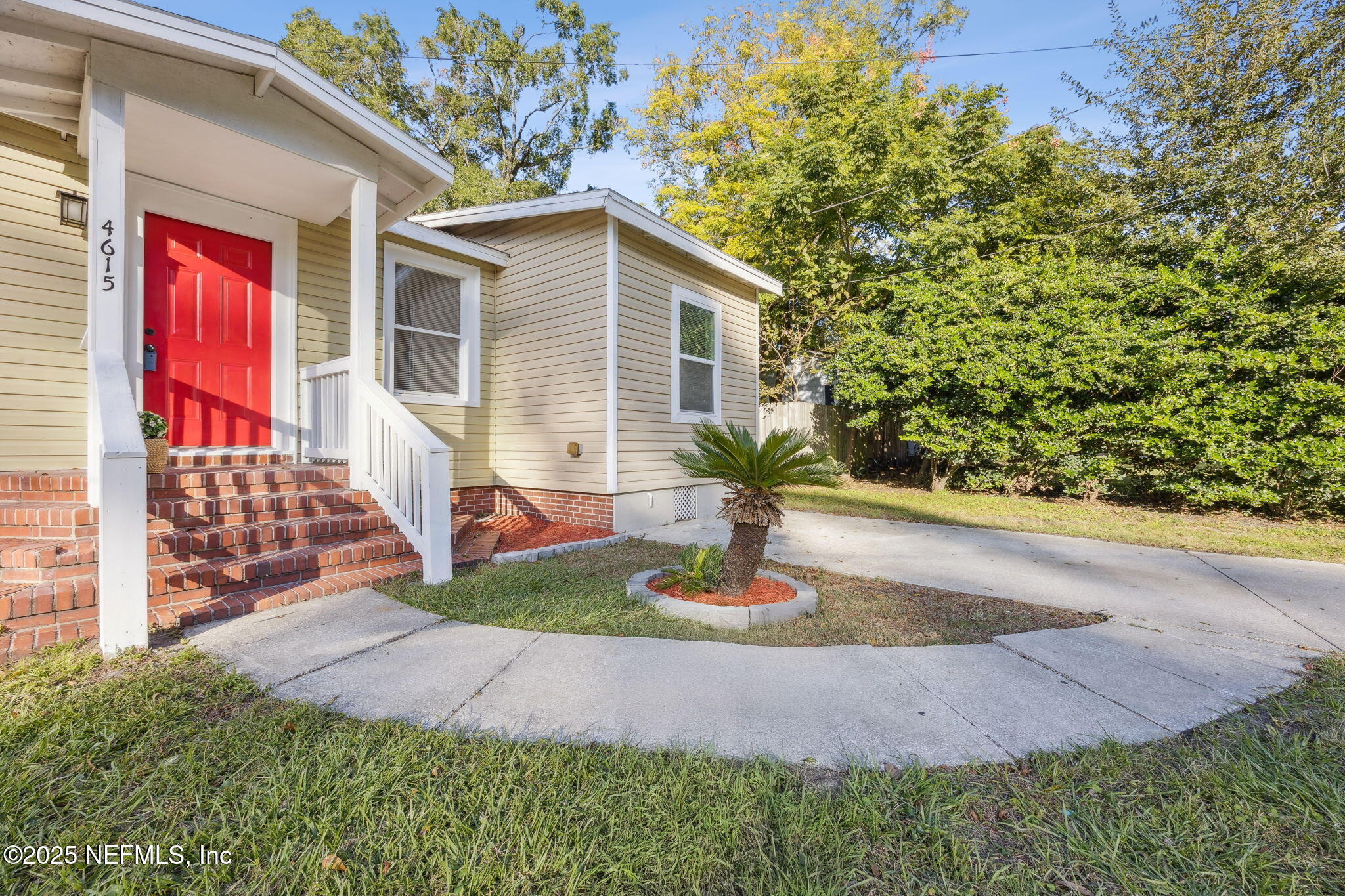 4615 Woolman Avenue Jacksonville, FL 32205 - Photo 6 of 34 a front view of a house with garden