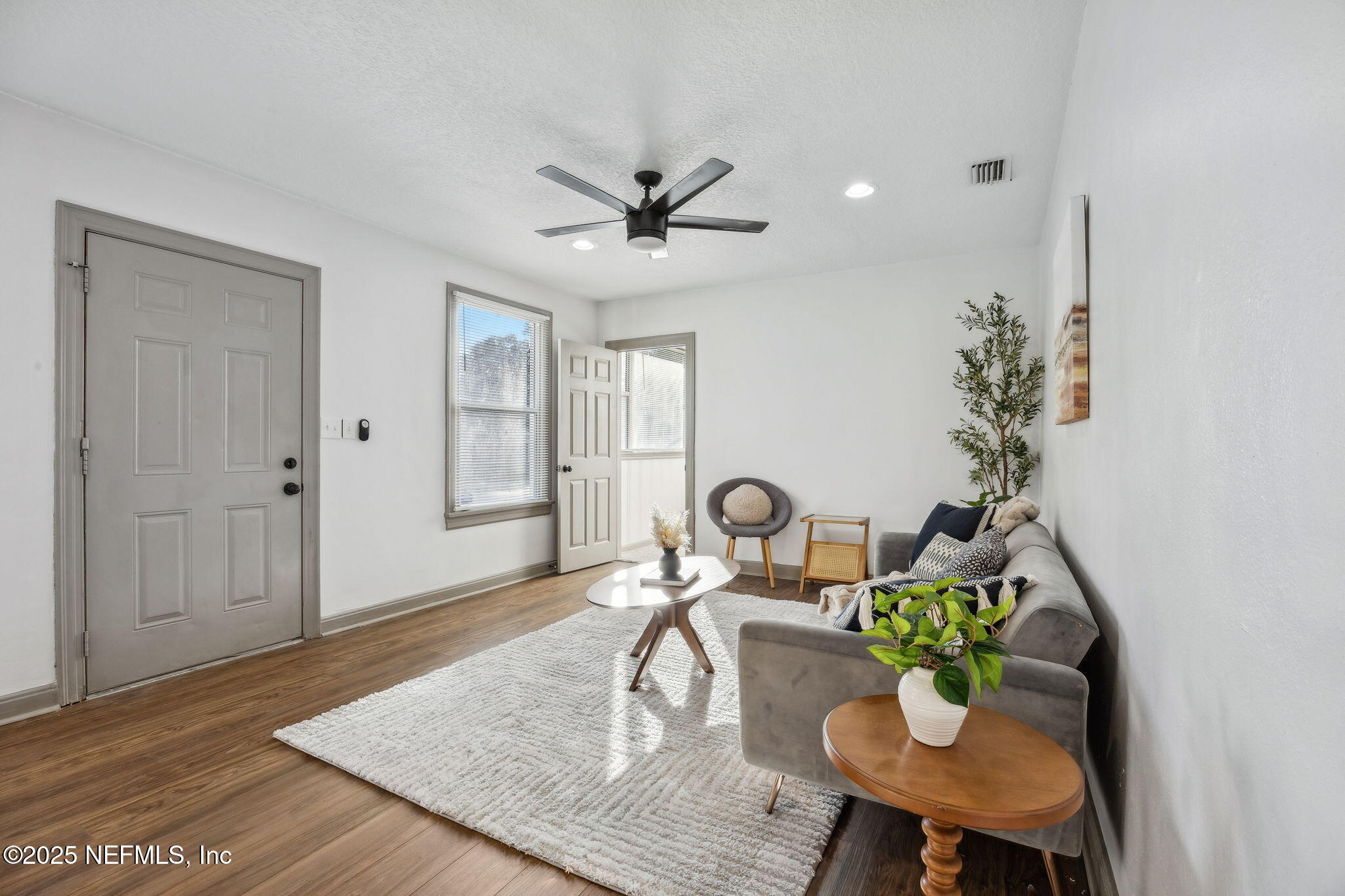 4615 Woolman Avenue Jacksonville, FL 32205 - Photo 7 of 34 a living room with furniture and a table