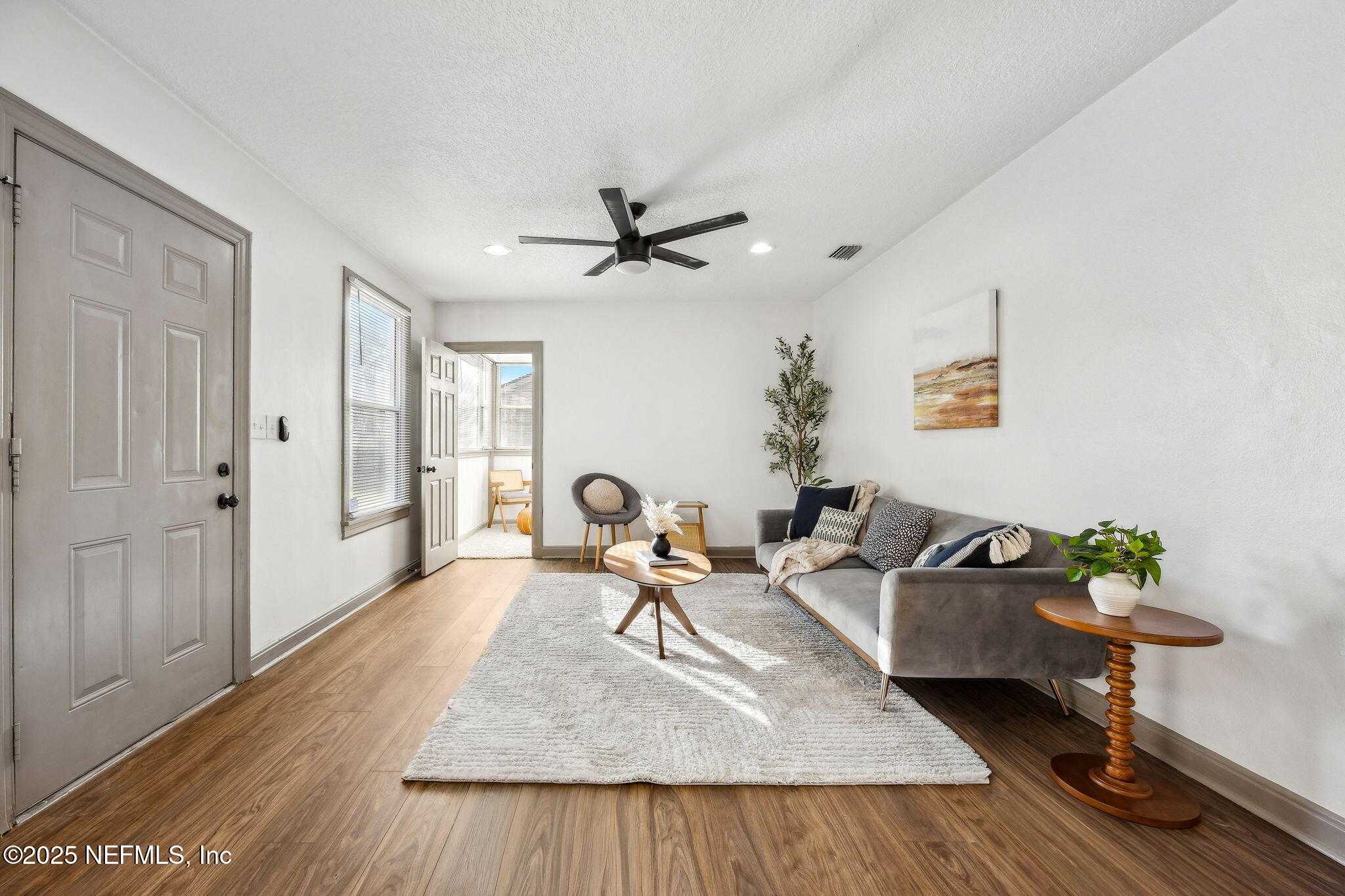 4615 Woolman Avenue Jacksonville, FL 32205 - Photo 8 of 34 a living room with furniture and wooden floor