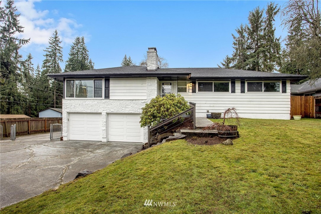 24326 Meridian Avenue South Bothell, WA 98021 - Photo 1 of 40 a view of a house with a yard and sitting area