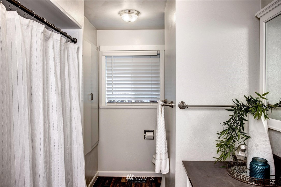 24326 Meridian Avenue South Bothell, WA 98021 - Photo 16 of 40 a view of a room with a windows and a potted plant