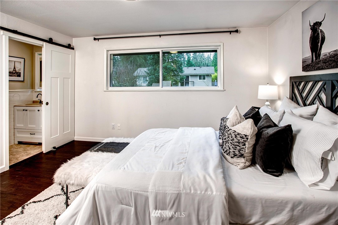 24326 Meridian Avenue South Bothell, WA 98021 - Photo 21 of 40 a bedroom with a bed and a window