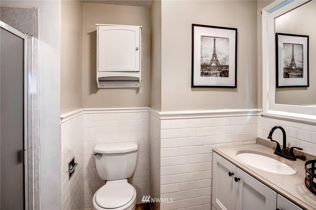 24326 Meridian Avenue South Bothell, WA 98021 - Photo 22 of 40 a bathroom with a toilet sink and mirror