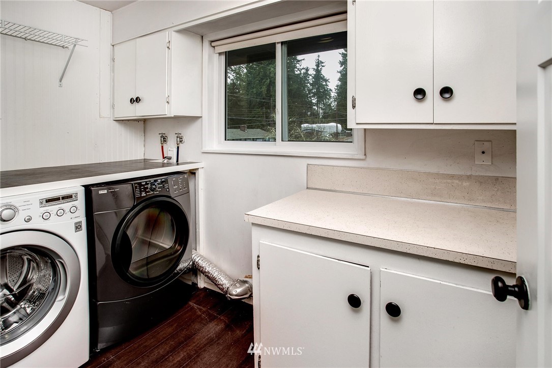 24326 Meridian Avenue South Bothell, WA 98021 - Photo 23 of 40 a utility room with sink dryer and washer