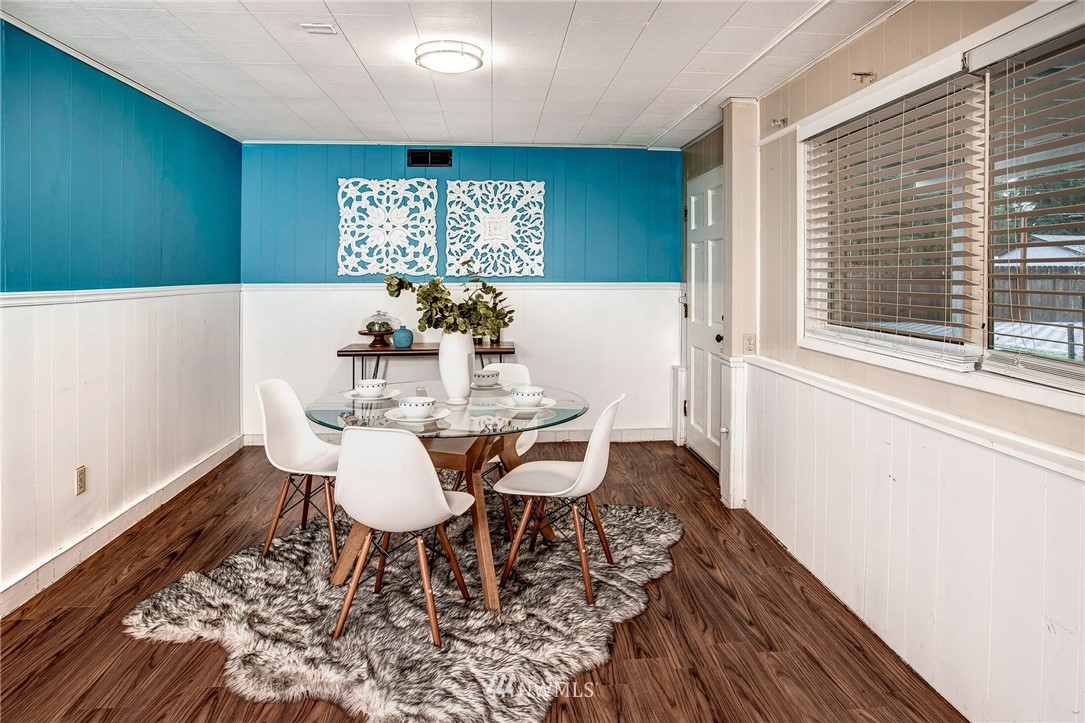 24326 Meridian Avenue South Bothell, WA 98021 - Photo 24 of 40 a view of a dining room with furniture and wooden floor