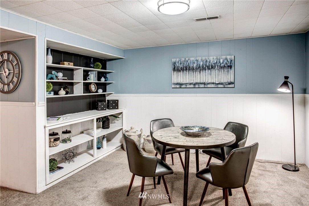 24326 Meridian Avenue South Bothell, WA 98021 - Photo 28 of 40 a view of a dining room with furniture and wooden floor