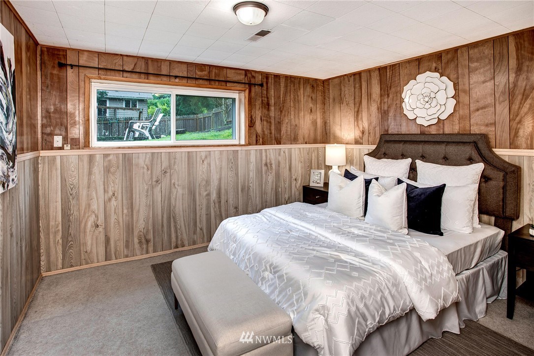 24326 Meridian Avenue South Bothell, WA 98021 - Photo 29 of 40 a bedroom with a bed and a window