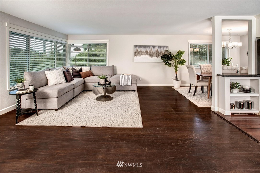 24326 Meridian Avenue South Bothell, WA 98021 - Photo 4 of 40 a living room with furniture wooden floor and a large window