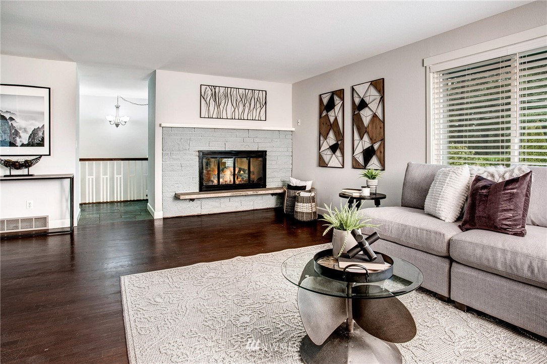 24326 Meridian Avenue South Bothell, WA 98021 - Photo 6 of 40 a living room with furniture and a wooden floor