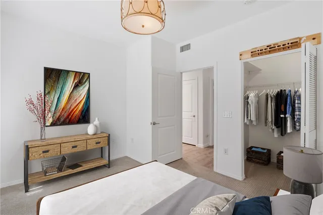 a bedroom with a bed and a television