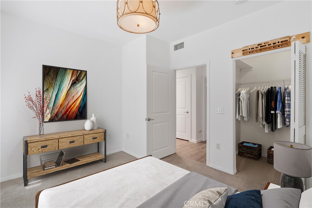 100 South Alameda Street, Unit 213 Los Angeles, CA 90012 - Photo 12 of 41 a bedroom with a bed and a television