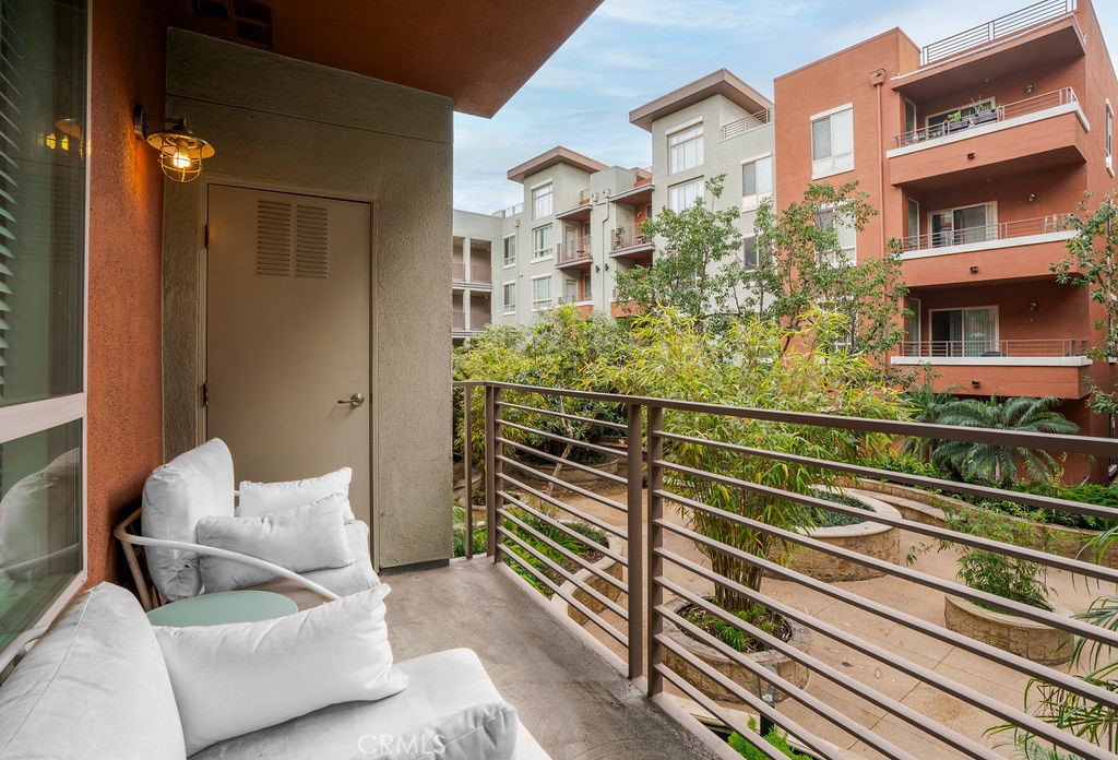 100 South Alameda Street, Unit 213 Los Angeles, CA 90012 - Photo 14 of 41 a view of a balcony with furniture