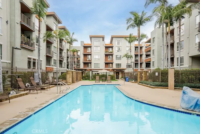 a swimming pool with outdoor seating and yard