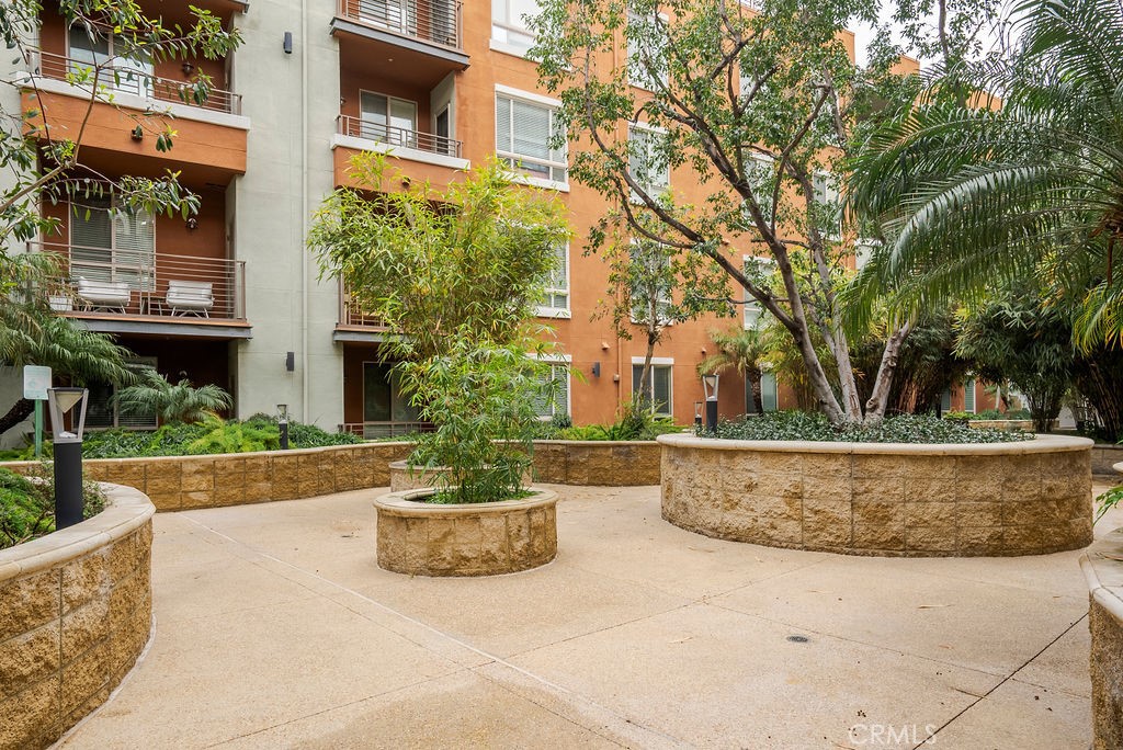 100 South Alameda Street, Unit 213 Los Angeles, CA 90012 - Photo 21 of 41 a view of a house with fountain in front of house