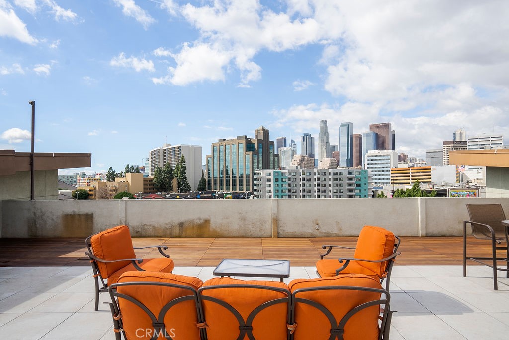 100 South Alameda Street, Unit 213 Los Angeles, CA 90012 - Photo 23 of 41 a outdoor sitting area with furniture and city view
