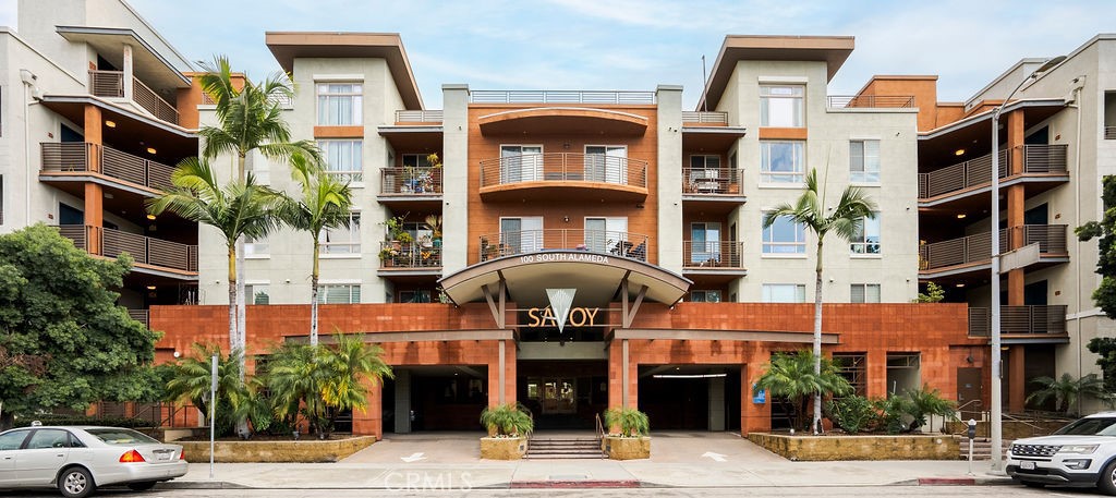 100 South Alameda Street, Unit 213 Los Angeles, CA 90012 - Photo 26 of 41 a front view of a building with a garden