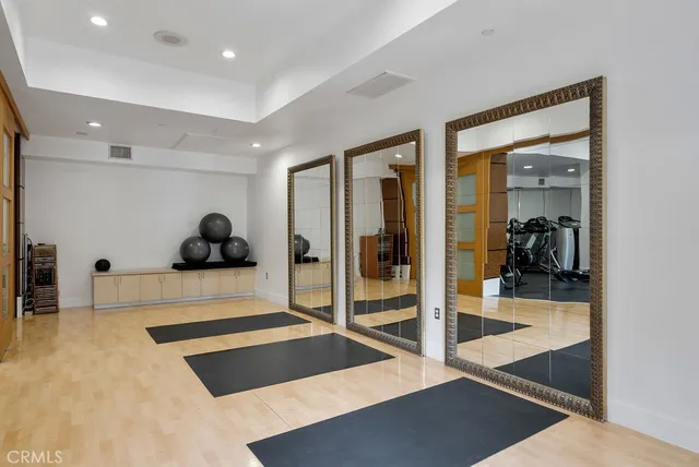 a view of a room with glass door and furniture