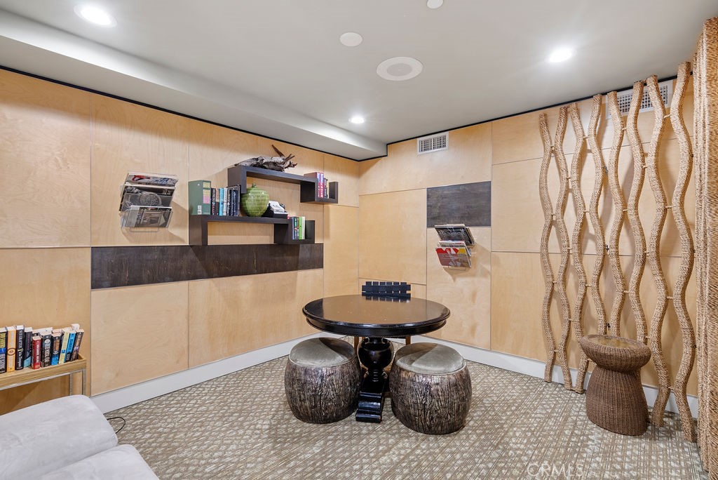 100 South Alameda Street, Unit 213 Los Angeles, CA 90012 - Photo 32 of 41 a living room with furniture and a wooden floor