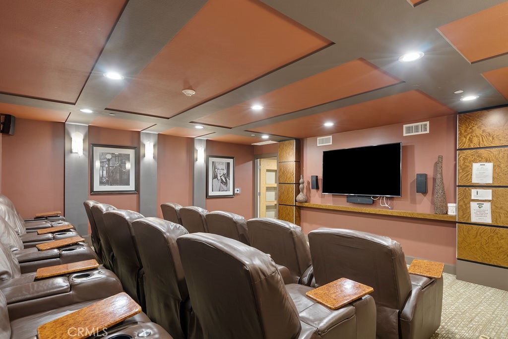 100 South Alameda Street, Unit 213 Los Angeles, CA 90012 - Photo 34 of 41 a living room with furniture and a flat screen tv