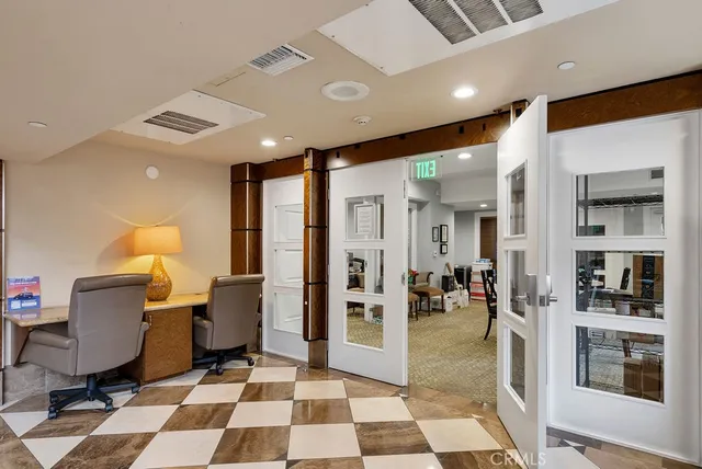 a living room with furniture and a walk in closet