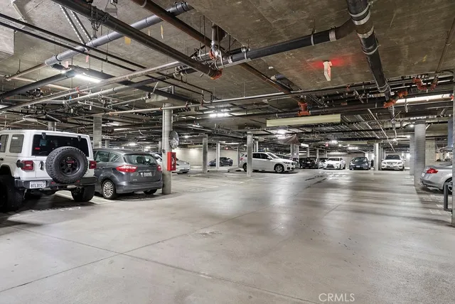 a view of parking garage with cars