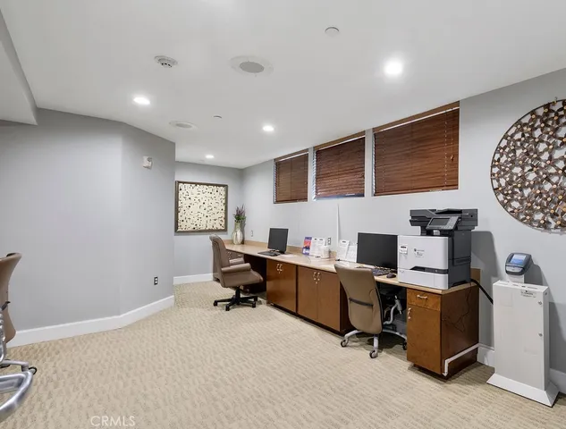 a workspace with furniture and window