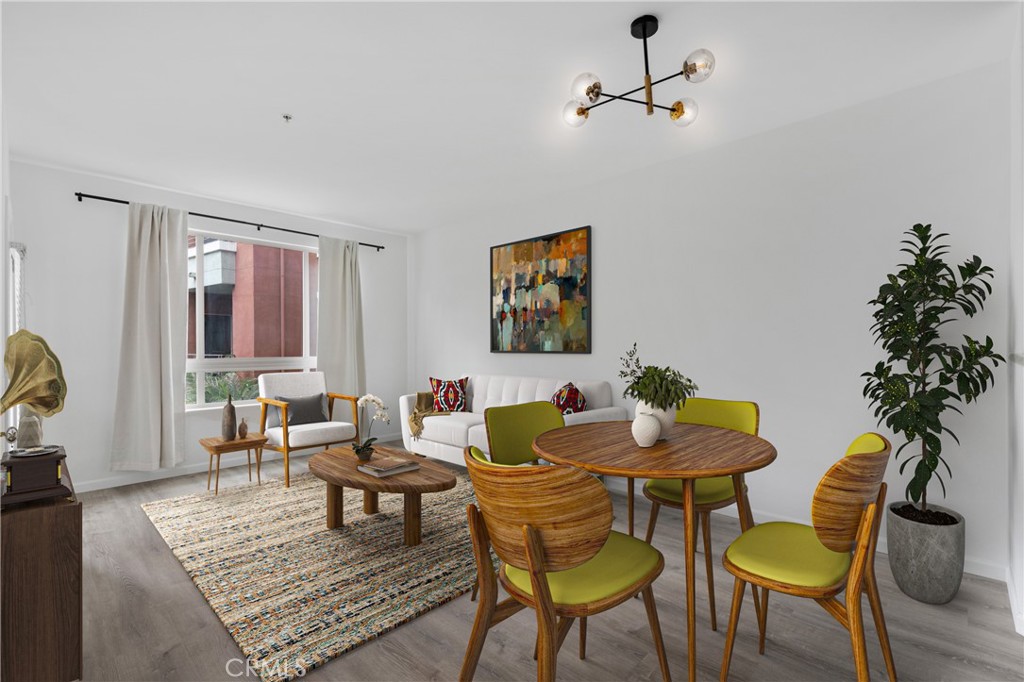 100 South Alameda Street, Unit 213 Los Angeles, CA 90012 - Photo 6 of 41 a living room with furniture and a potted plant