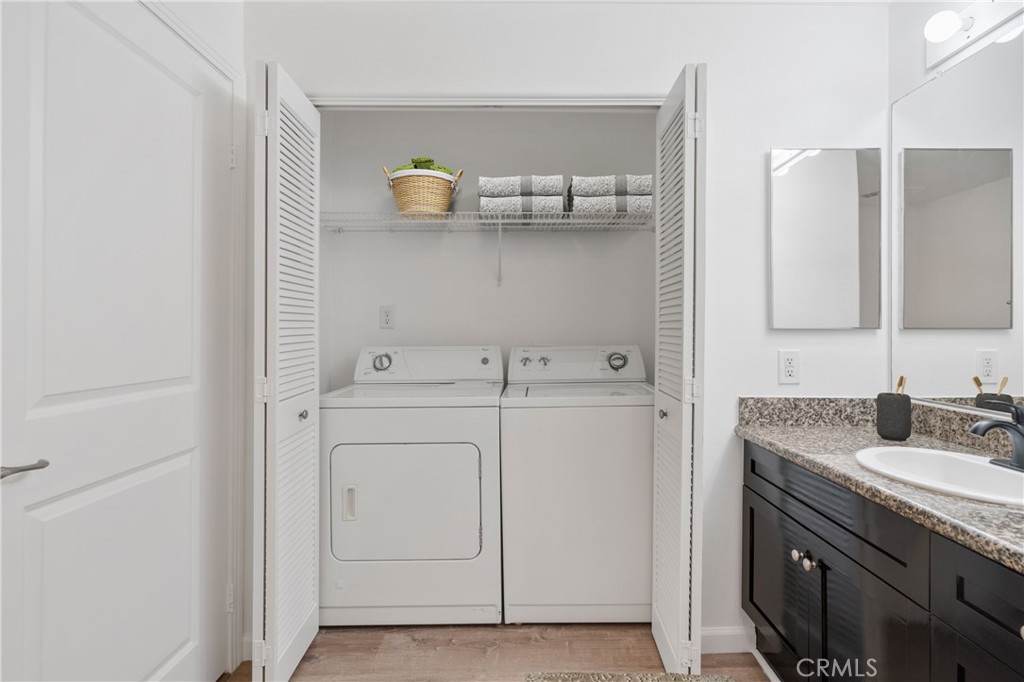 100 South Alameda Street, Unit 213 Los Angeles, CA 90012 - Photo 8 of 41 a bathroom with a sink and a mirror