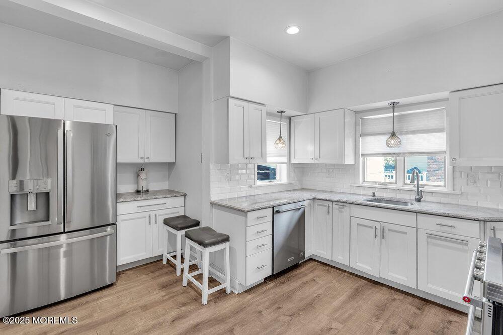 708 18th Avenue Lake Como, NJ 07719 - Photo 12 of 35 a kitchen with a sink cabinets stainless steel appliances and a window