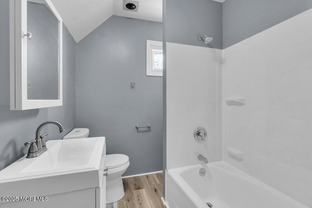 708 18th Avenue Lake Como, NJ 07719 - Photo 18 of 35 a bathroom with a sink a toilet and shower