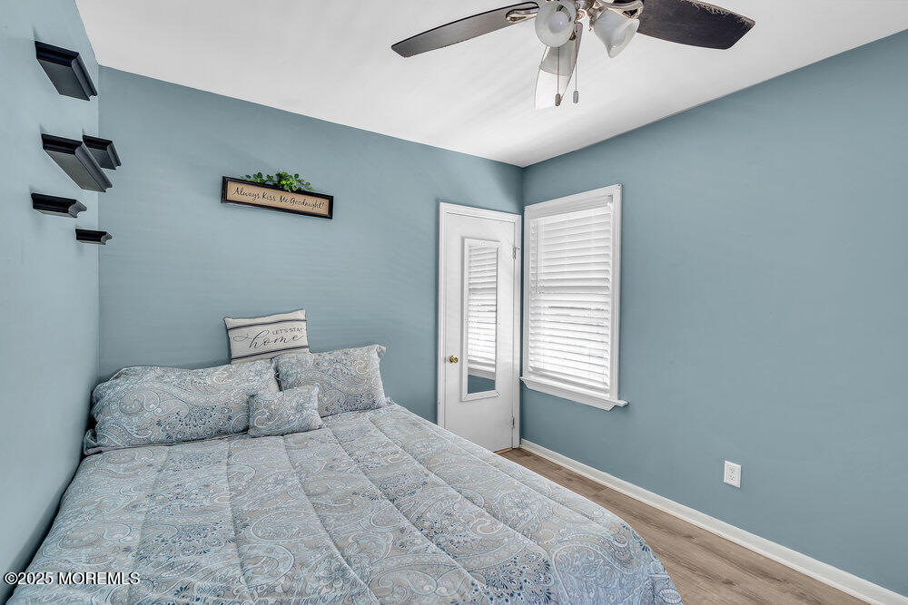 708 18th Avenue Lake Como, NJ 07719 - Photo 19 of 35 a bedroom with a large bed and a window