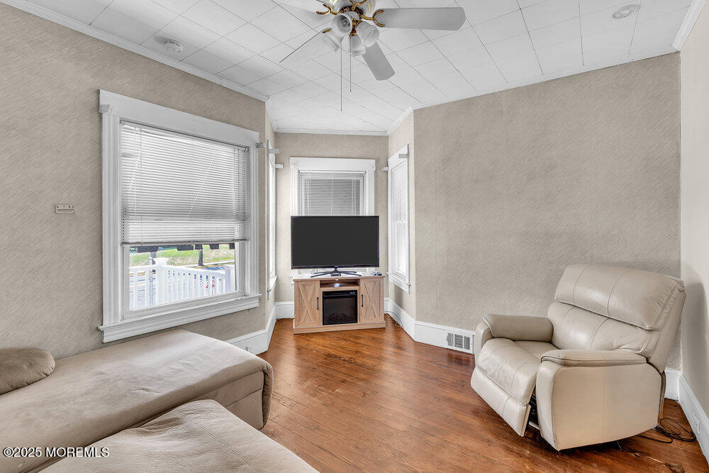 708 18th Avenue Lake Como, NJ 07719 - Photo 8 of 35 a living room with furniture and a flat screen tv