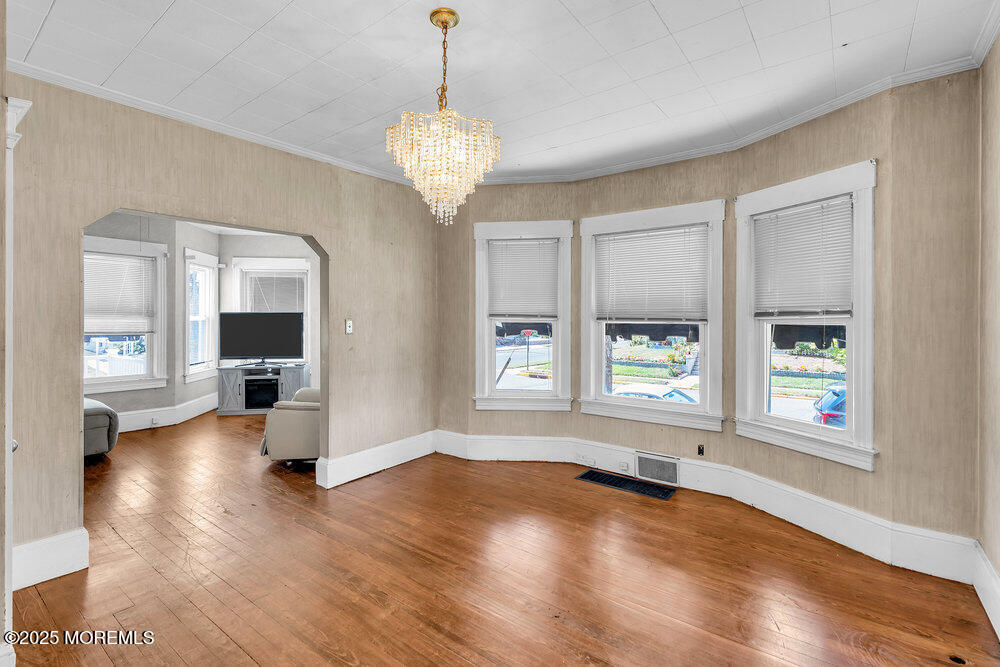 708 18th Avenue Lake Como, NJ 07719 - Photo 9 of 35 an empty room with wooden floor and windows