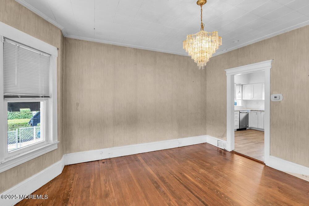 708 18th Avenue Lake Como, NJ 07719 - Photo 10 of 35 a view of empty room with wooden floor and fan