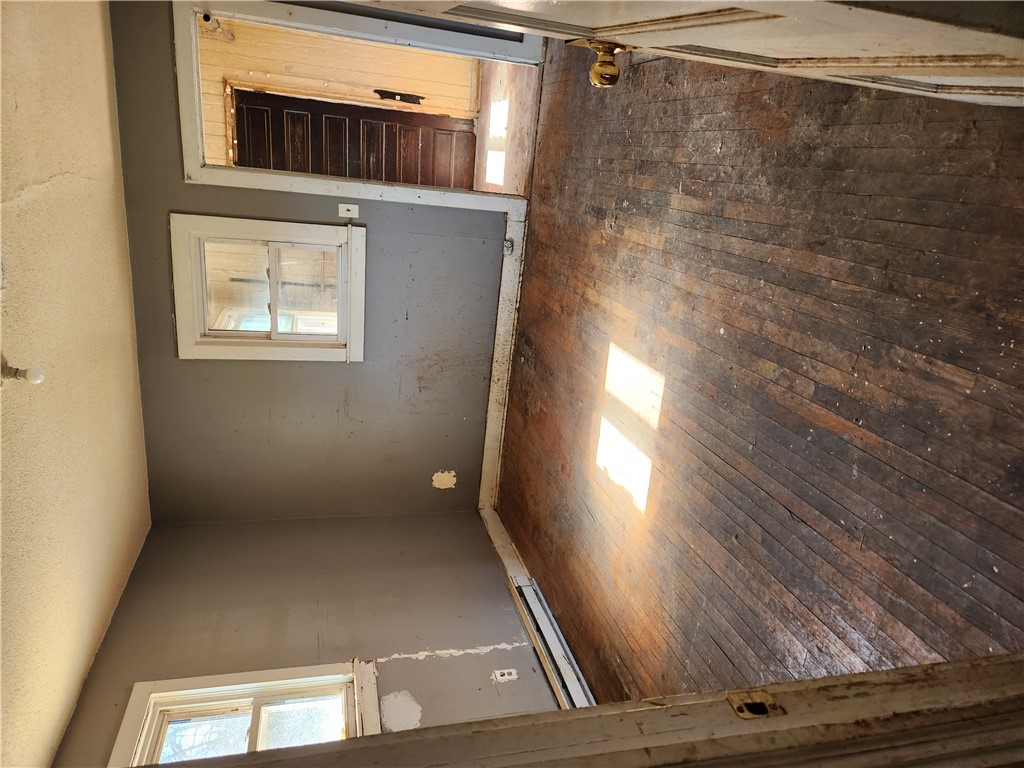 1326 Chiquola Avenue Honea Path, SC 29654 - Photo 15 of 15 This interior room features classic hardwood flooring and ample natural light from two windows.