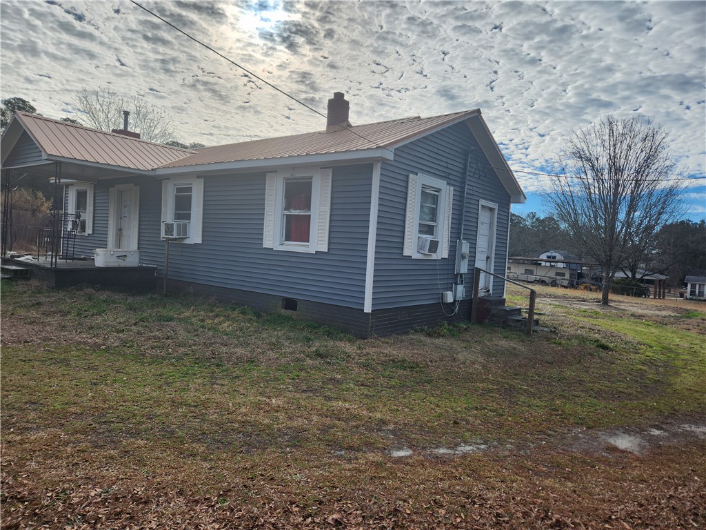 1326 Chiquola Avenue Honea Path, SC 29654 - Photo 2 of 15 This charming residence features classic siding and a durable metal roof.