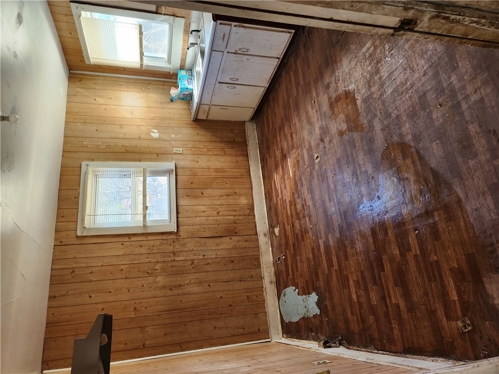 1326 Chiquola Avenue Honea Path, SC 29654 - Photo 10 of 15 This kitchen space presents a canvas for renovation, featuring wood paneling and existing cabinetry.