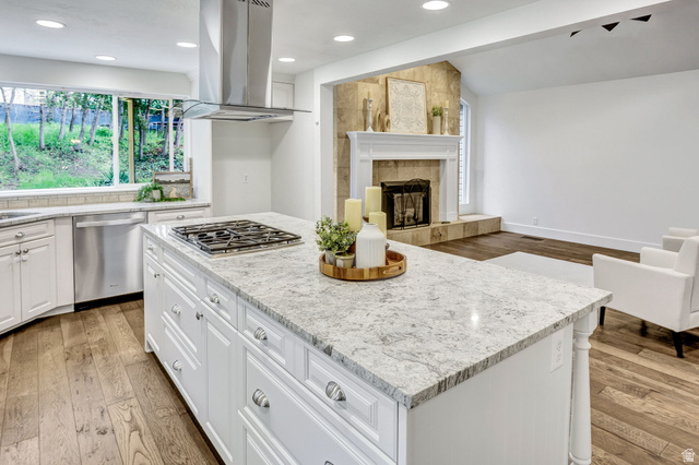 1320 Canyon Park Road Bountiful, UT 84010 - Photo 28 of 28 Kitchen with light wood-style floors, vaulted ceiling, island range hood, a center island, and open floor plan