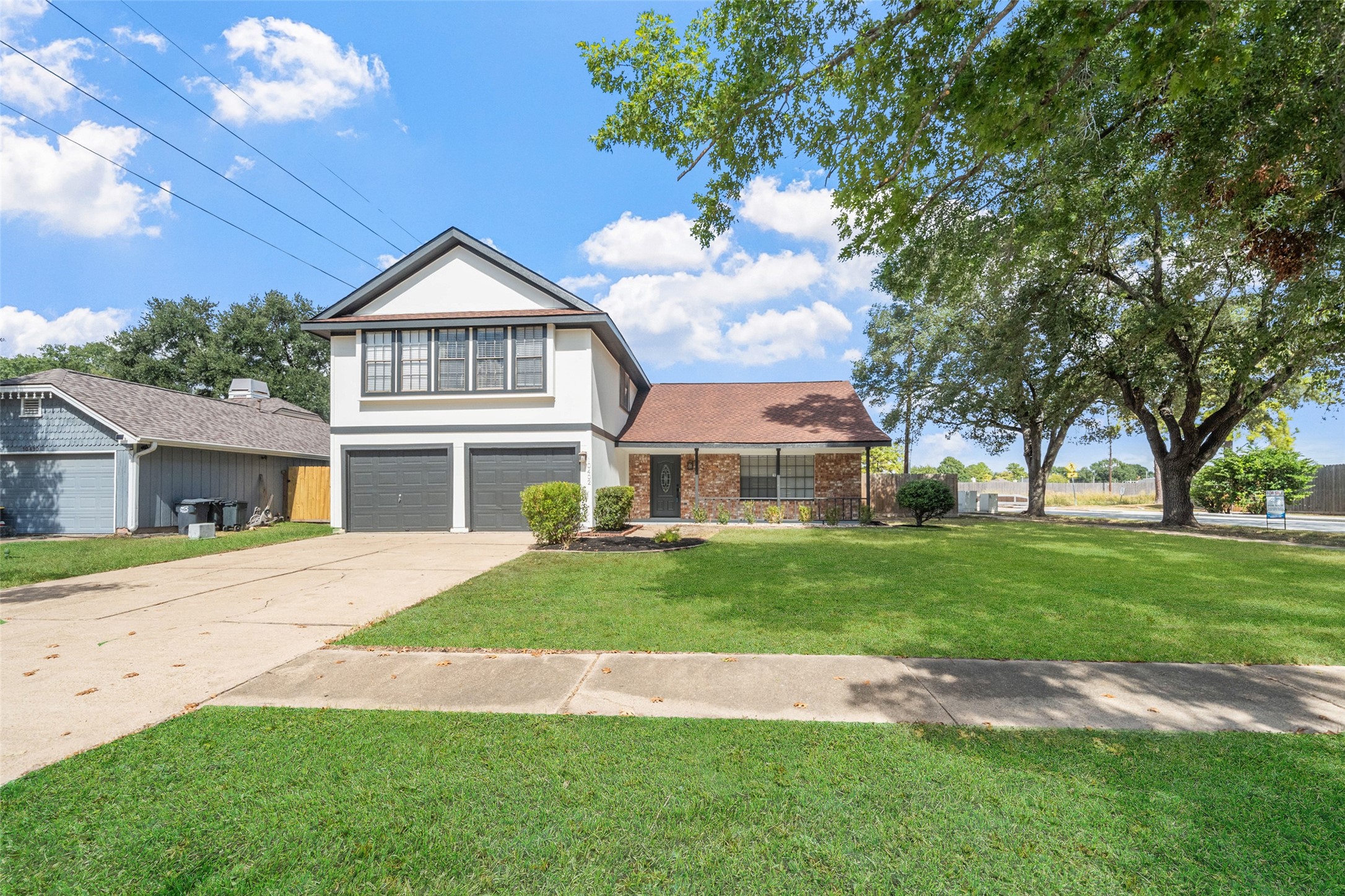 10402 Trading Post Drive Houston, TX 77064 - Photo 2 of 43 a front view of a house with a garden