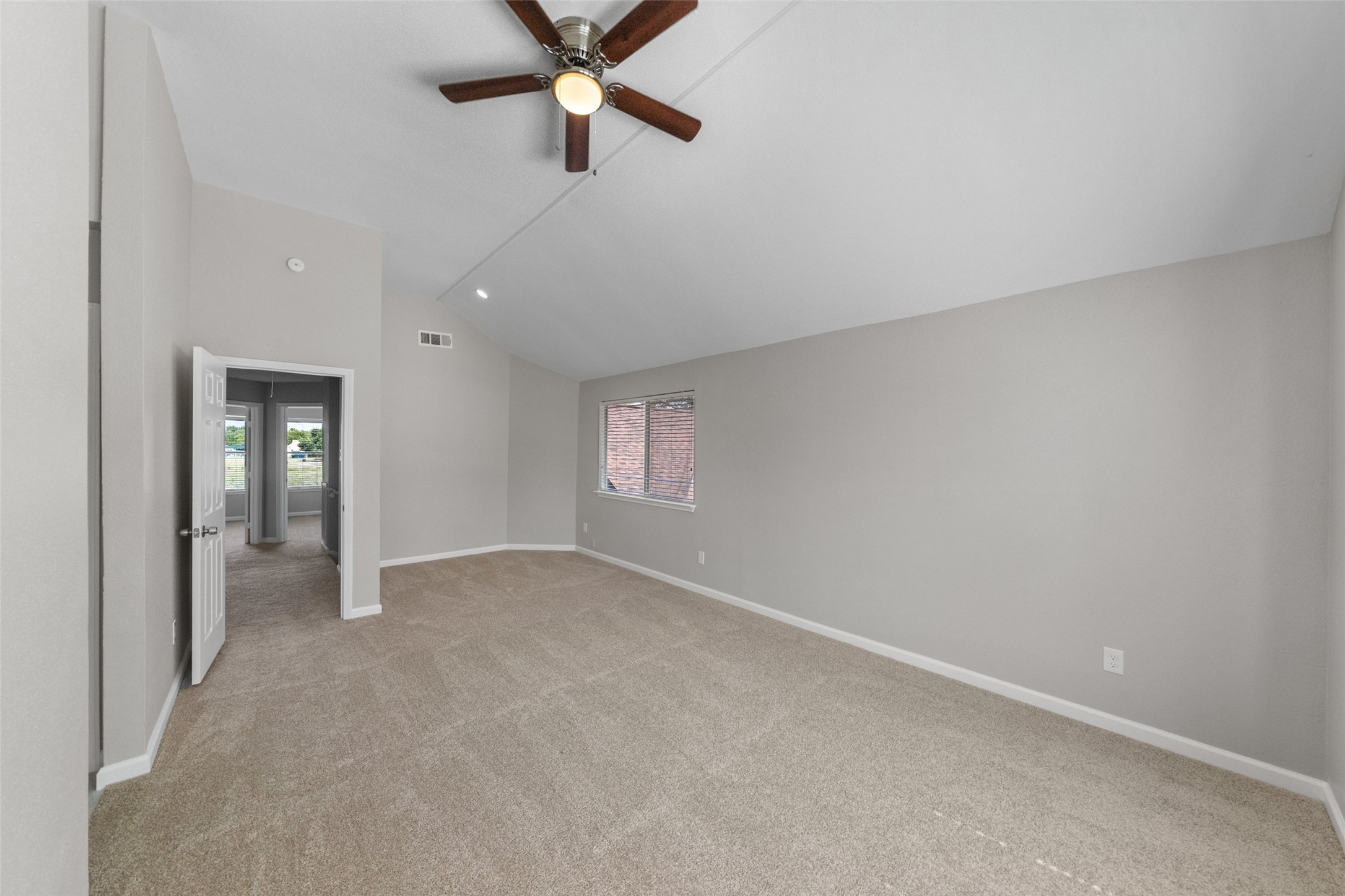 10402 Trading Post Drive Houston, TX 77064 - Photo 21 of 43 an empty room with chandelier fan and windows