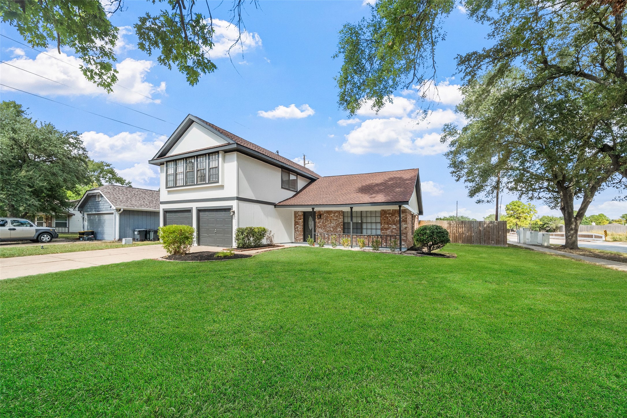 10402 Trading Post Drive Houston, TX 77064 - Photo 3 of 43 a front view of a house with a garden